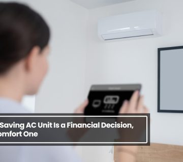 Woman controlling an energy saving AC unit with a smartphone in a modern home, highlighting smart and efficient cooling technology